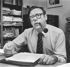 Arthur M. Okun at his desk