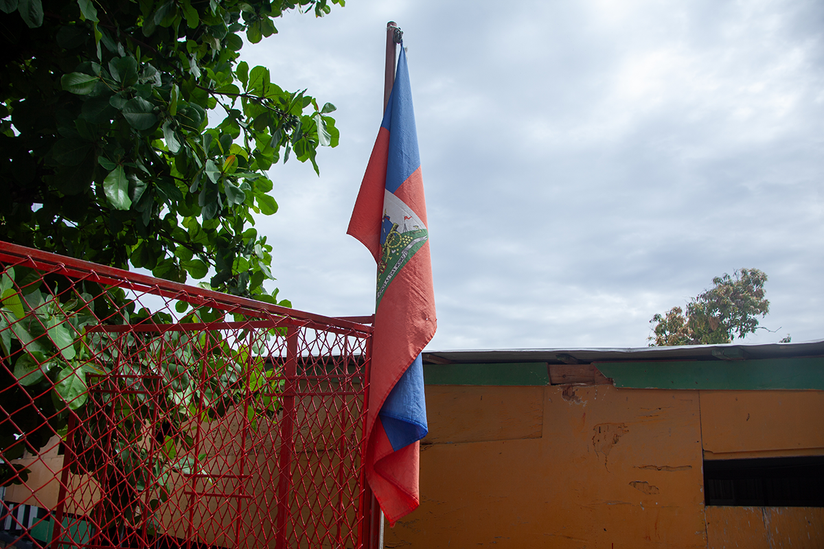 A Haitian flag in front of a public school