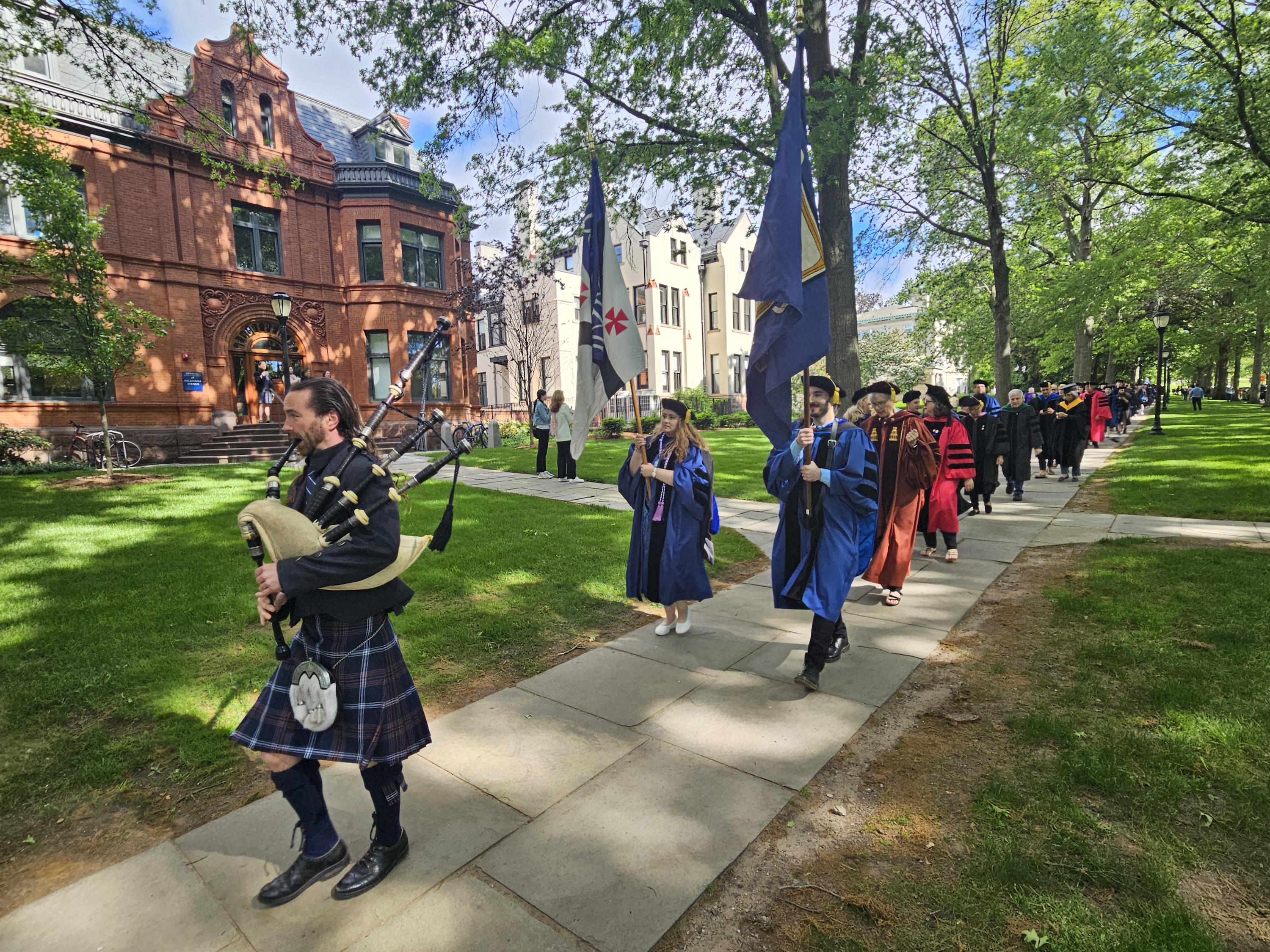 Yale graduates proceeding down Hillhouse Avenue. 