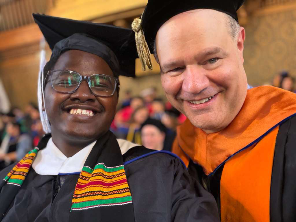 Two men in graduation robes