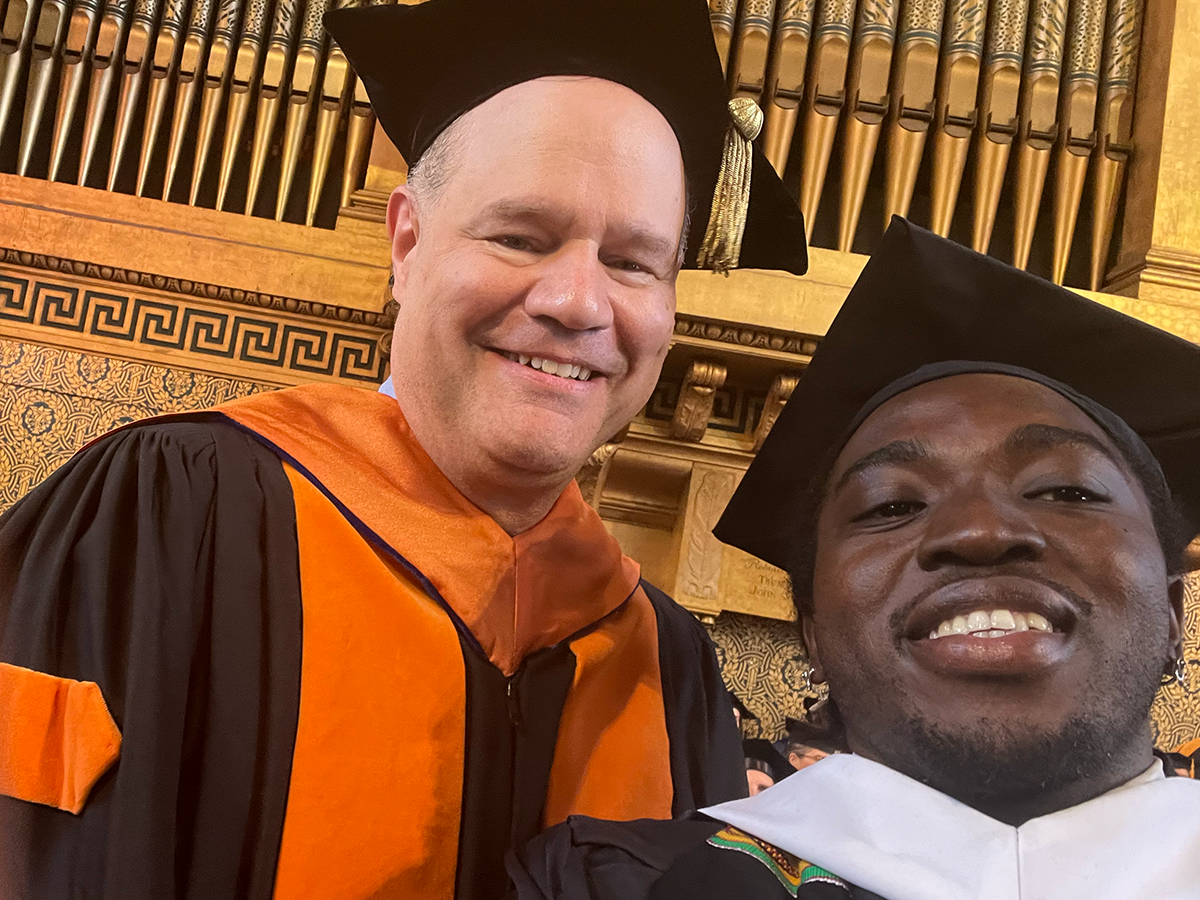 Two men in graduation robes