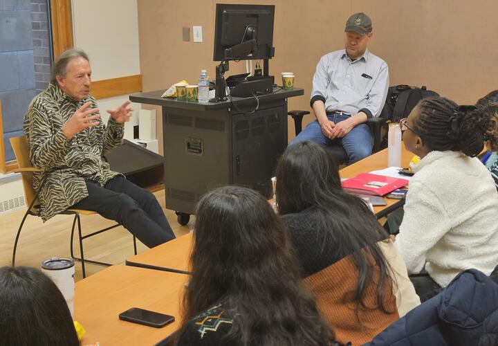 A group of IDE students with Chris Udry